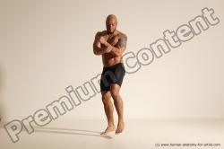 Underwear Gymnastic poses Man Black Muscular Bald Dancing Dynamic poses Academic